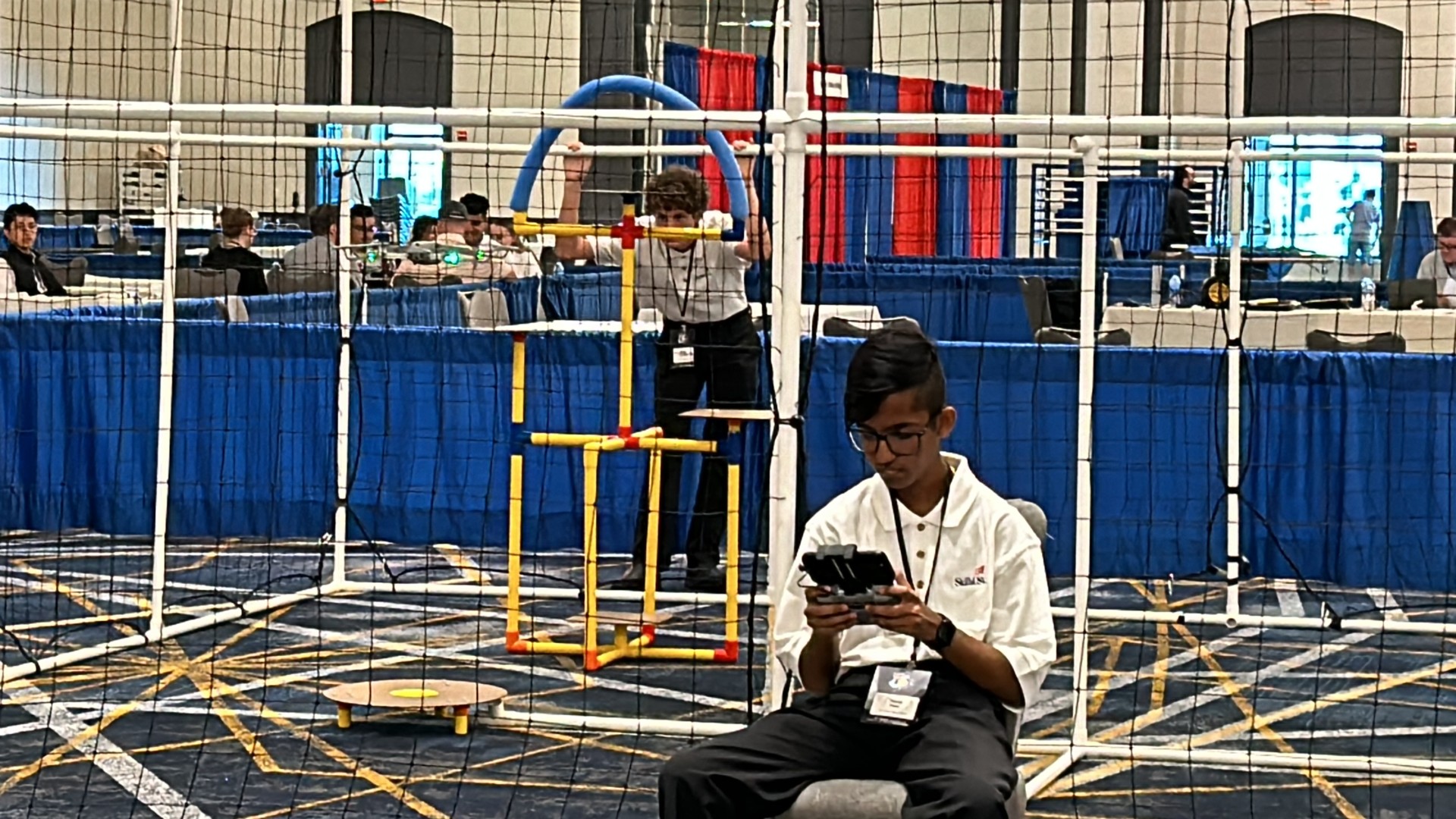 A child sitting in a chair in front of a netDescription automatically generated